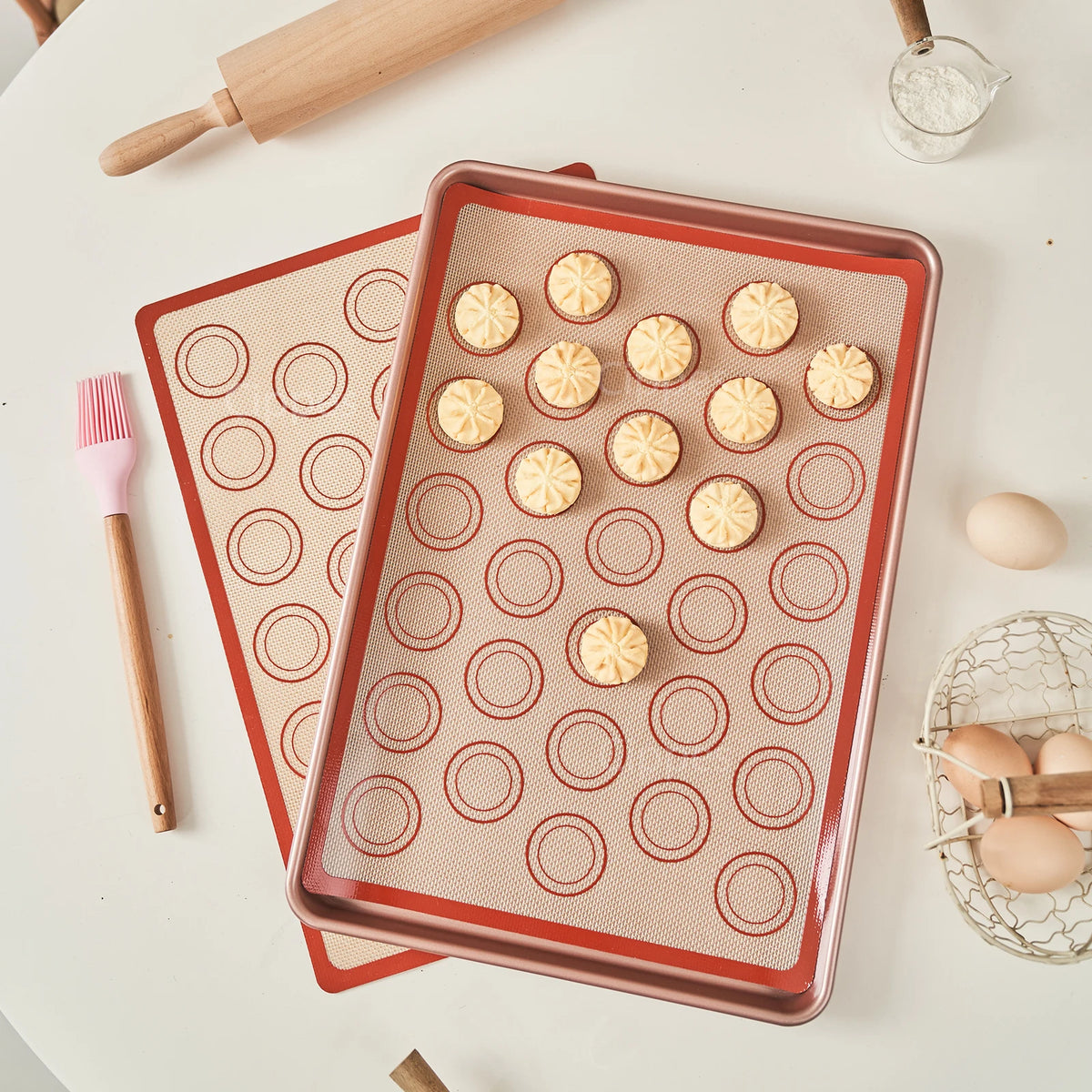 Silicone baking mats on a baking tray with cookies