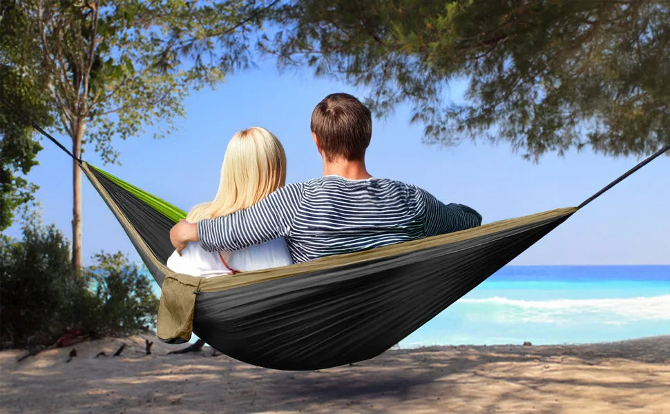 Camping hammock at sunset by the sea