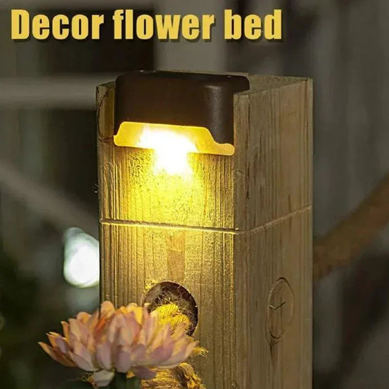 Solar deck lights on wooden railing
